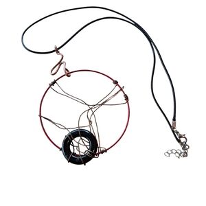 Artistic Red and Black Necklace with Bold Design